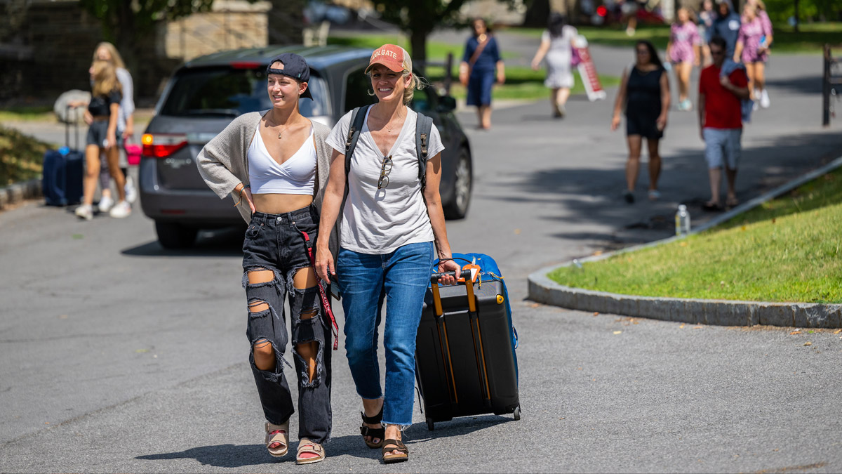 Student and parent arriving on campus